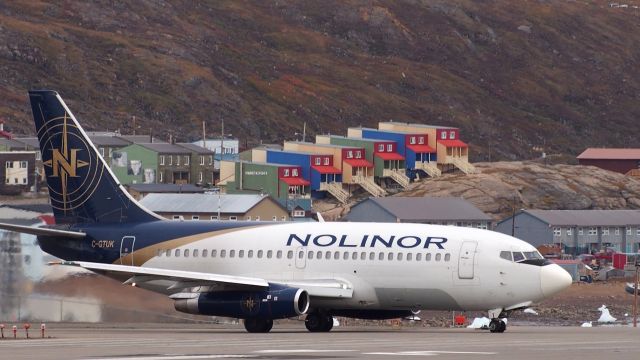 Boeing 737-200 (C-GTUK) - Preparing to leave Iqaluit airport.  The skid plate on the front wheel prevents gravel from puncturing the fuselage on unpaved runways. Nolinors 737-200 were featured on an episode of Mighty Planes.