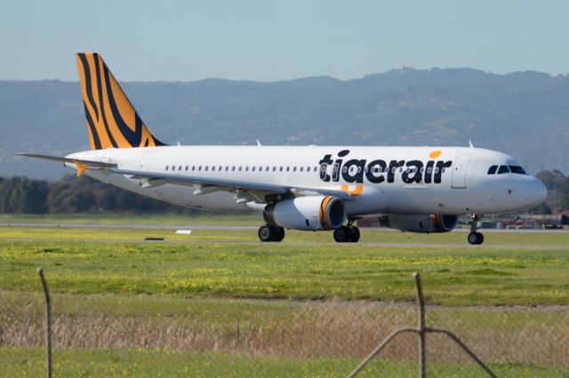 Airbus A320 (VH-VNC) - On taxiway heading for take-off on runway 05. Tuesday 22nd July 2014.