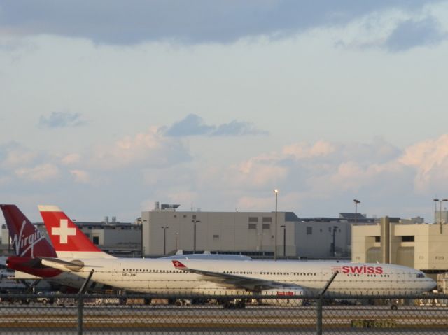 Airbus A330-300 (HB-JHH) - Alongside a Virgin B747-400