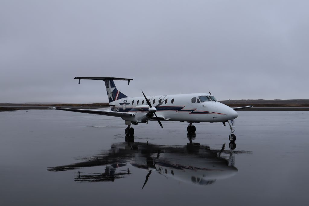 Beechcraft 1900 (N125AX) - Fuel stop. Parked off of runway 8-26, taxi A and B.