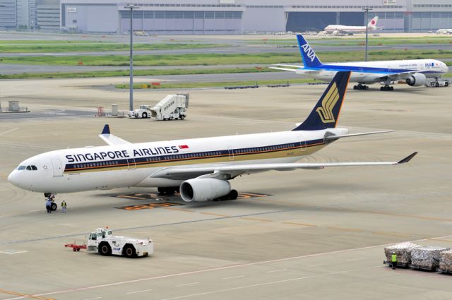 Airbus A330-300 (9V-STG) - With an ANA B777 behind. Now Flying with TAP-Portugal as CS-TOW, Named João Vaz Corte-Real 