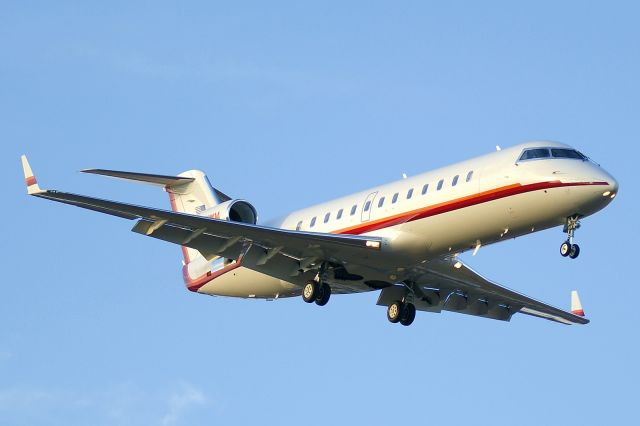 Canadair Regional Jet CRJ-200 (N711WM) - 12R approach at sunset