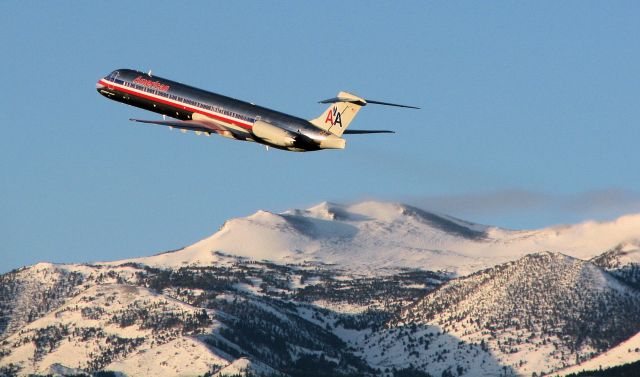 McDonnell Douglas MD-83 (N973TW) - The shadows and the golden glow of the scene easily reveal the time of day.  Just a few moments after sunrise, this MD-83 climbs away past Mt. Rose (just south of Reno Tahoe International) at the start of an early morning flight to KDFW.