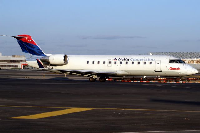 Canadair Regional Jet CRJ-100 (N949CA) - Taxiing to Terminal 3 on 21-Oct-06.  With Comair from Sep-95 to Oct-07.  Broken up at KTUS.