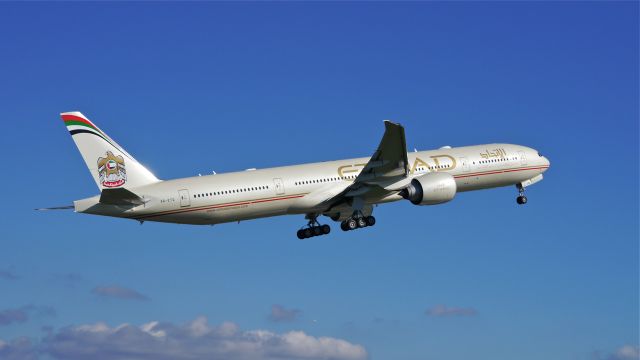 BOEING 777-300 (A6-ETQ) - ETD9057 climbs from Rwy 16R beginning a delivery flight to Abu Dhabi Int'l (OMAA / AUH) on 9.26.13. (LN:1137 cn 41700).