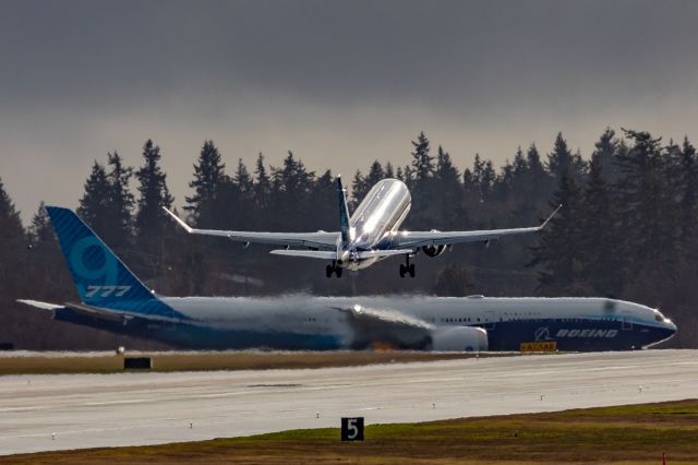 Embraer 175 (N6510X) - An Alaska Embraer 175L off the deck at Paine Field flying over B777X