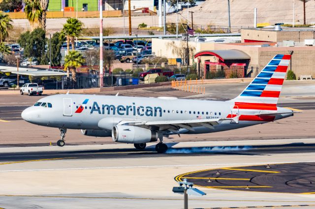 Airbus A319 (N828AW) - An American Airlines A319 landing at PHX on 2/28/23. Taken with a Canon R7 and Canon EF 100-400 L ii lens.