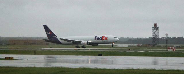 BOEING 767-300 (N126FE) - 9/17/17 landing on Rwy 8R during early stages of TS Imelda