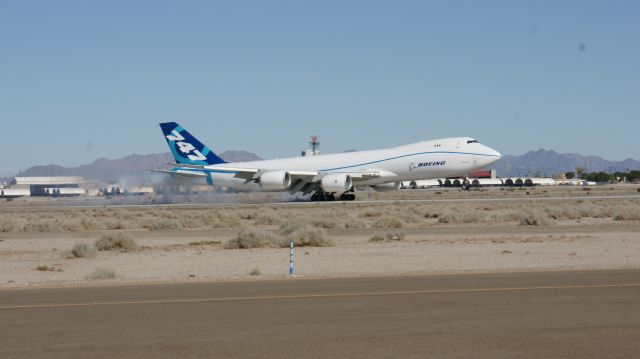 BOEING 747-8 (N5017Q) - See the tire smoke fly...landing at KNYL Aug 31, 2010.