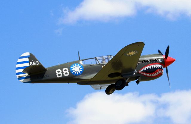 CURTISS Warhawk (ANZ3009) - Gear coming up on climbout.