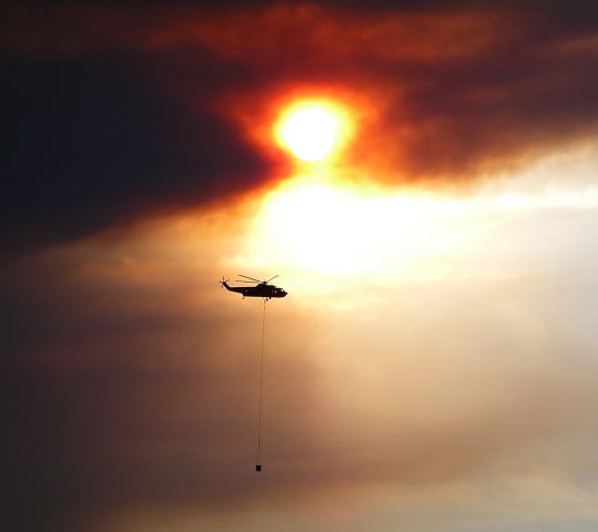 Sikorsky Sea King — - Running water buckets to the fire