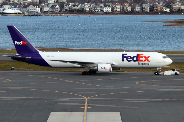 BOEING 767-300 (N124FE) - FDX 767 being towed from N. Cargo to the FedEx Terminal in S. Cargo