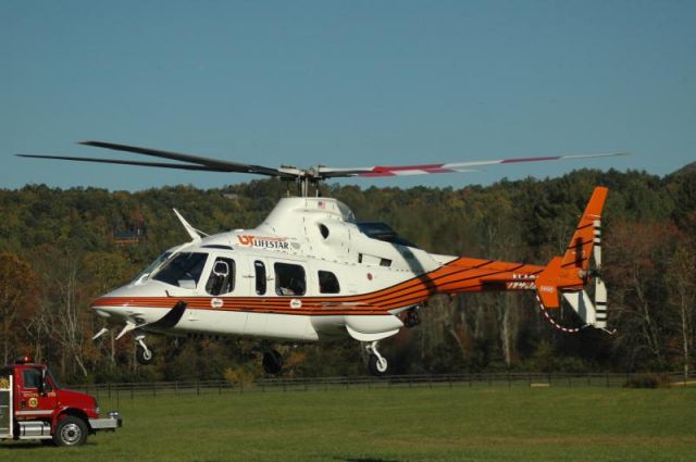 Bell 430 (N432UT) - A Life Star helicopter from University of TN Medical Center in Knoxville, TN departs a landing zone in Murphy, NC.