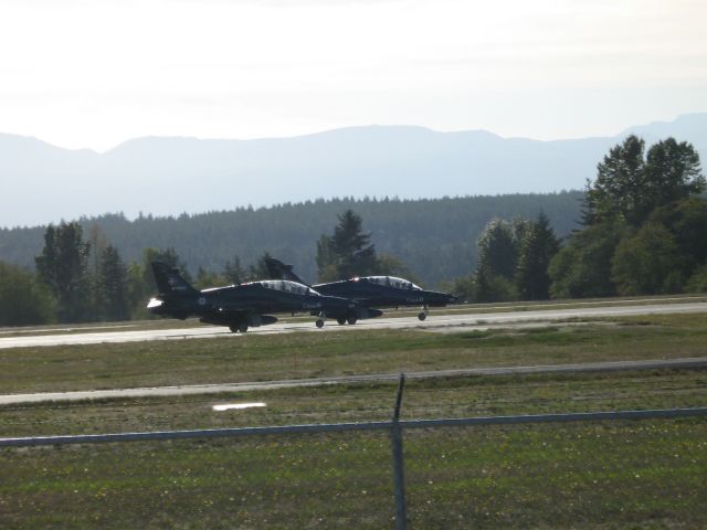 — — - A pair of Hawk 115s - Canadian Forces NATO Trainers, from CFB Cold Lake Alberta taxies for take off at CFB Comox BC