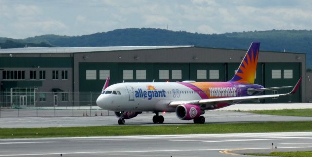 Airbus A320 (N198NV) - Taxiing for departure is this 2016 Allegiant Airbus 320-214 sporting the "Insomniac Livery" in the Spring of 2025.