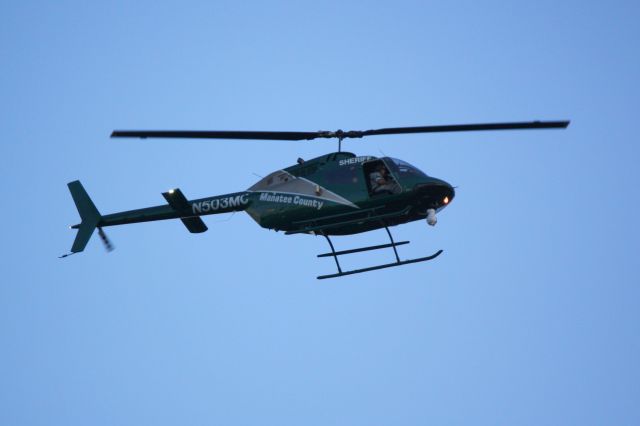 Bell JetRanger (N503MC) - Manatee County Sheriffs Office Aviation Unit (N503MC) flies over Sarasota-Bradenton International Airport