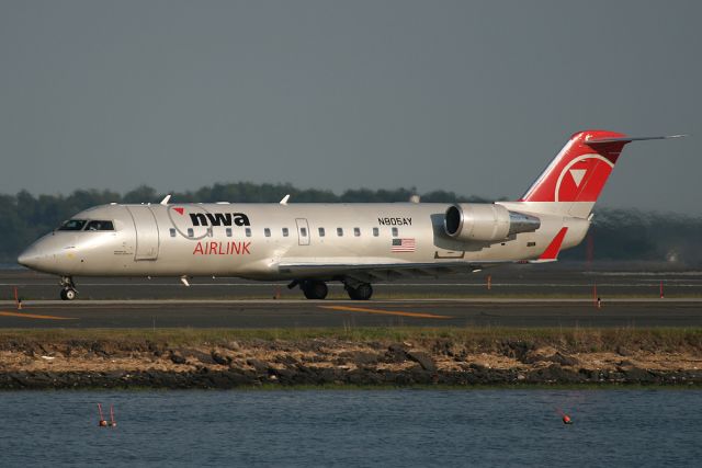 Canadair Regional Jet CRJ-200 (N805AY) - Northwest Airlink/Pinnacle Airlines taxis on November to runway 22R for departure. Photo taken on May 20, 2010