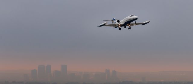 Learjet 35 (N474KA) - Early morning flight to the west with Denver, CO in the background