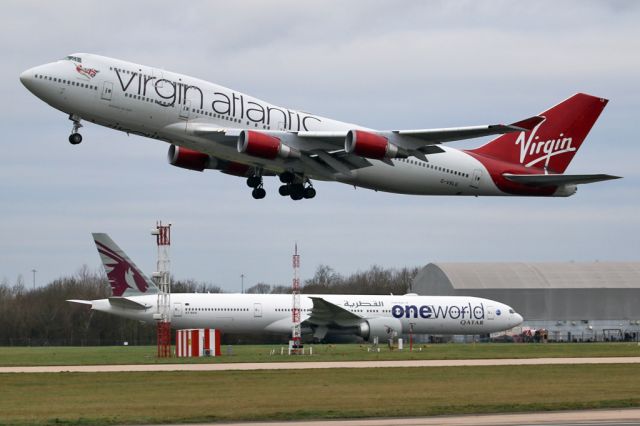 Boeing 747-400 (G-VXLG) - VIR75 off to Orlando as QTR27 taxies to the gate after arriving from Doha.