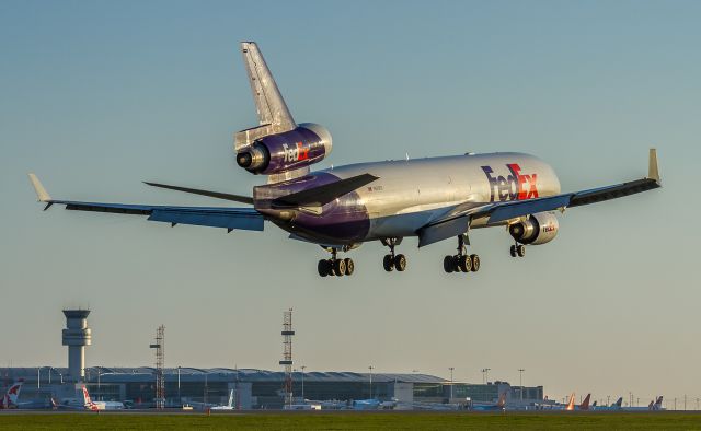 Boeing MD-11 (N625FE) - Another rare Fedex landing on 06L. The Fedex ramp is clear on the other side of the airport… up early to catch this one in the first rays of the day.