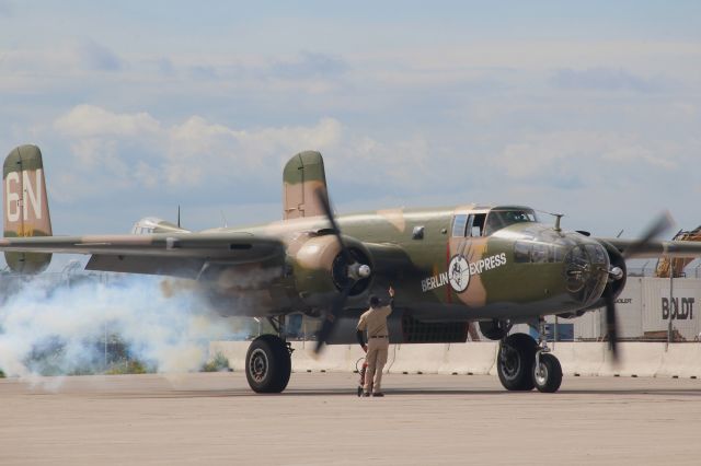 North American TB-25 Mitchell (N410V) - The EAA's Berlin Express fires up for the day's flights.  No. 2 Engine with a smoky start.