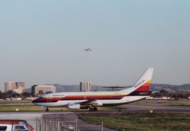 BOEING 737-300 (N307AC) - KSJC - pre 1990 view of San Jose with AA/Aircal merger 737-300 just arrived from SNA rolling to terminal C while Federal Express DC-10 approaches 30L.