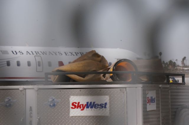 Canadair Regional Jet CRJ-200 (N889AS) - Looking over the power unit on a SkyWest CRJ-200.  The plane previously flew with Atlantic Southeast Airlines and ExpressJet before coming over to Skywest.  But today she flew as US Airways Express 2934.  Taken with a Sony Nex 6.  3.26.14