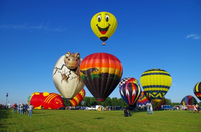 Unknown/Generic Balloon — - SOLBERG AIRPORT-READINGTON, NEW JERSEY, USA-JULY 25, 2015: Seen at the 2015 Quick Chek New Jersey Festival of Ballooning were two dinosaur themed hot air balloons and a smiley face hot air balloon.