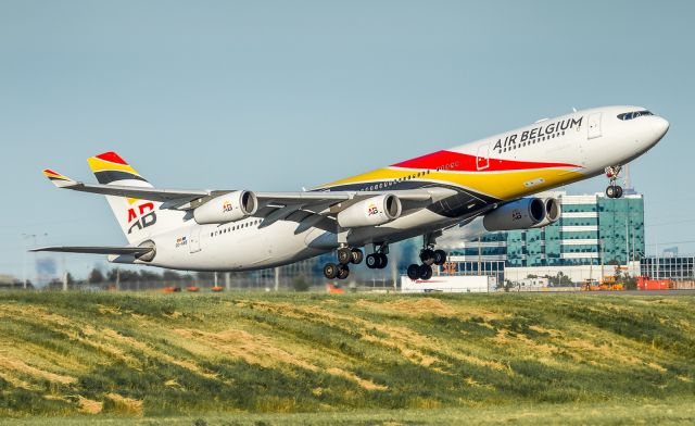 Airbus A340-300 (OO-ABB) - Air Belgium A343 lifts off runway 24R operating as BA92 to Heathrow for British Airways