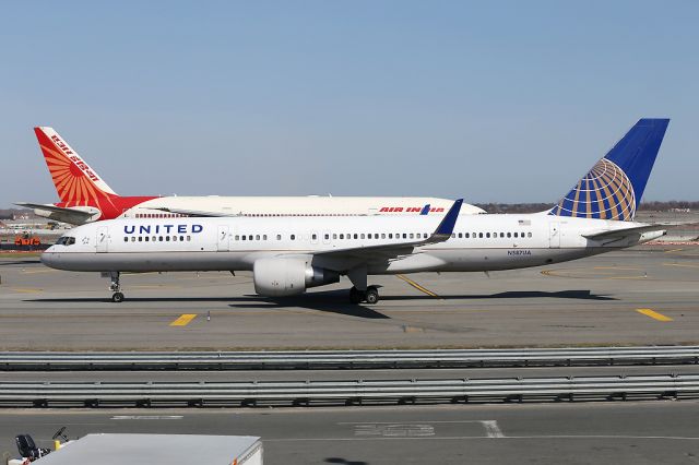 Boeing 757-200 (N587UA) - UA758 arriving from SFO with larger sibling behind.  6 April 2015