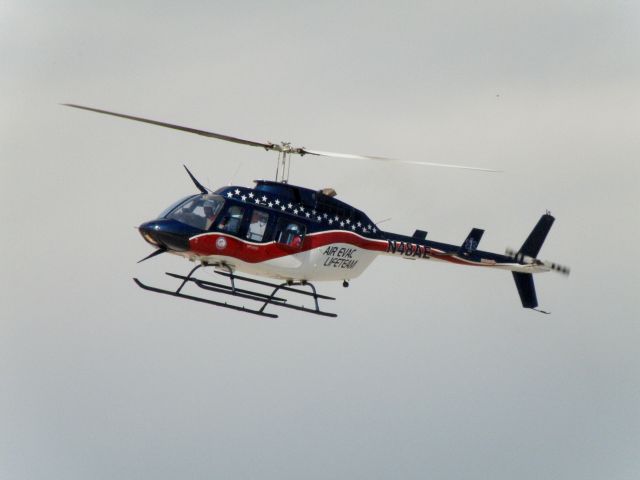 Bell JetRanger (N48AE) - Air Evac 43 (N48AE) based at Campbellsville, KY lifts off from the tarmac at Blue Grass Airport (KLEX) after a refueling stop at TAC Air ....