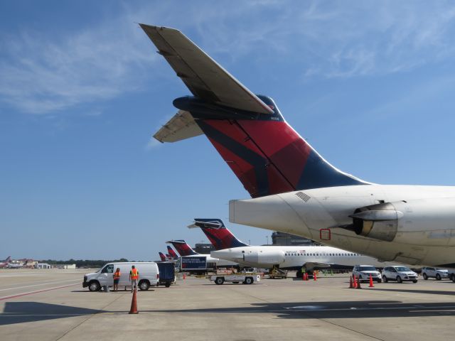 McDonnell Douglas MD-88 (N900DE) - Tail of the last MD-88 in Delta service, and MadDogs at the US major airlines. This is a scene that won't be replicated ever again: t-tails en-masse at ATL