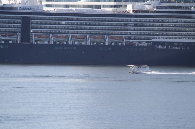 C-FGQZ — - A Dehavilland Beaver taking off from Vancouvers harbour.  The Holland America Line cruise ship Zuiderdam (in Dutch South Lady)  I love Vancouver!