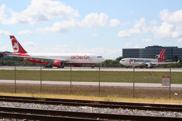 Airbus A330-300 — - Air Berlin A330 and Martinair Cargo MD-11 in background waiting for takeoff clearance.