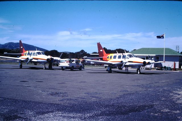 Piper Navajo (VH-BRL) - Promair navajo,s VH-EYF and VH-BRL unloading, Flinders Island ,1982. Promair operated from 1975 to 1995.(My 1st full time flying job, 1985-88)