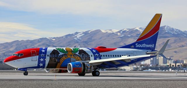 Boeing 737-700 (N280WN) - With the wing surfaces dirty and the thrust reversal system deployed (the sleeves on the engine nacelles have both moved rearward), Southwest's "Missouri One" (N280WN) decelerates after landing on runway 16L to complete an early afternoon KPHX-KRNO flight.