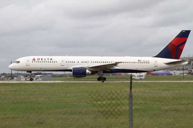 Boeing 757-200 (N6704Z) - Delta's daily 757 flight departs KAUS 10 minutes behind schedule.