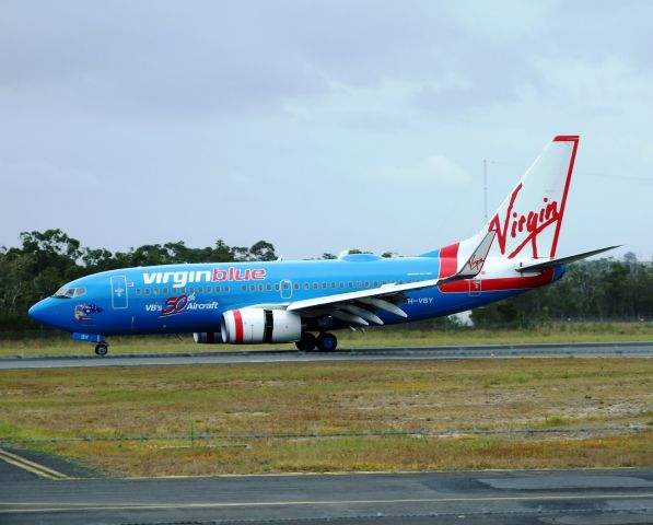 Boeing 737-700 (VH-VBY) - To celebrate the arrival of their 50th aircraft Virgin Blue (Australia) painted this aircraft bright blue.