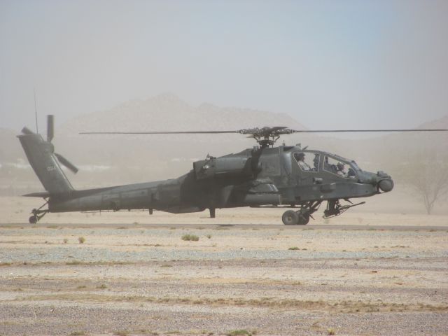 — — - An AH-64 attack helicopter landing at the 2009 Copperstate Airshow in Casa Grande, Arizona