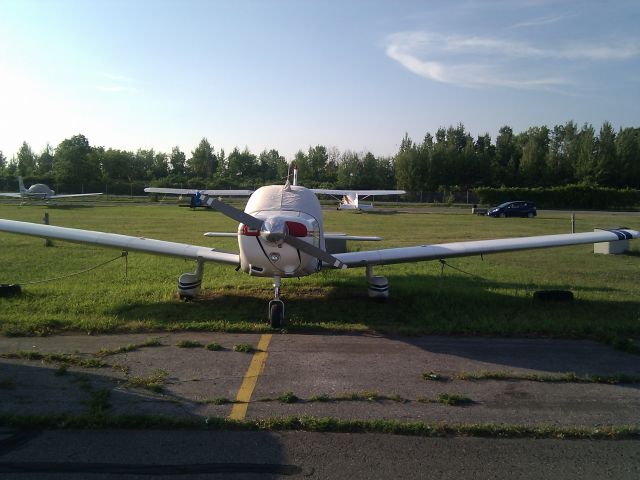 Piper Cherokee (C-FBJO) - Tied down after a flight back from Boston.