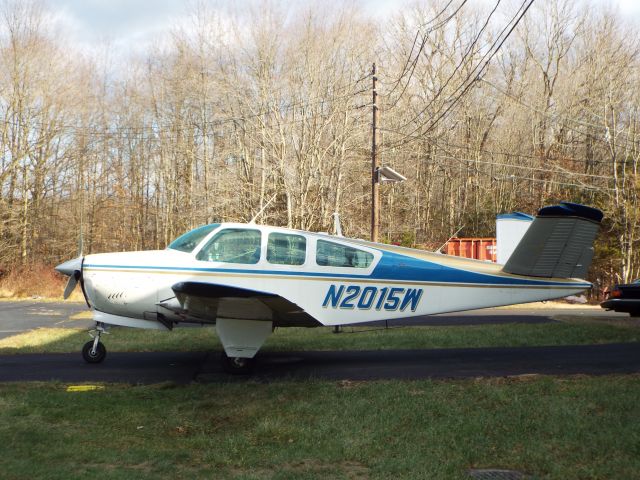 Beechcraft 35 Bonanza (N2015W) - out behind a building at 39N