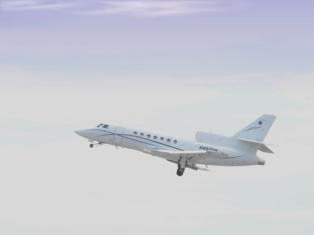 Dassault Falcon 50 (N497SB) - Shown here in the Winter of 2013 this Bird has just left the end of the runway and is heading for the sky.