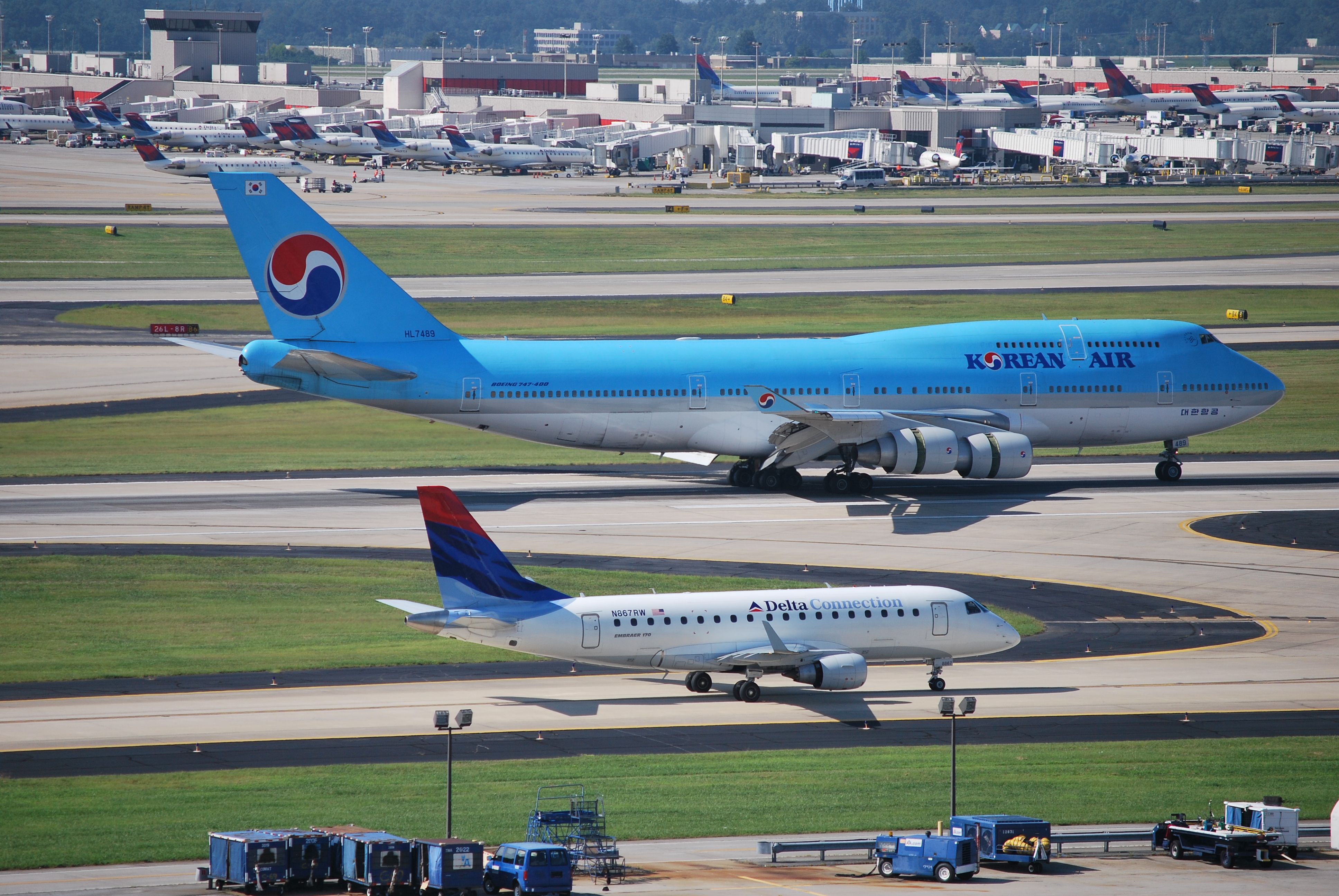 — — - Taxiing to the terminal while a KAL 744 arrives on runway 26R - 8/22/09