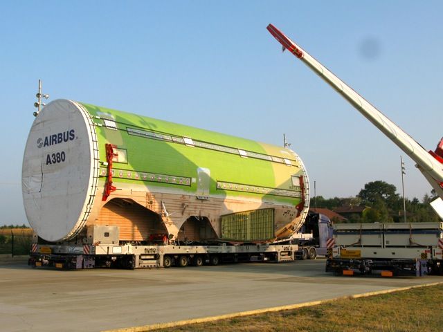 Airbus A380-800 — - Airbus A380 parts being trailered to Toulouse for assembly. They arrive on the French coast from England and Germany and are moved to Toulouse by night (about 40KM) per day.