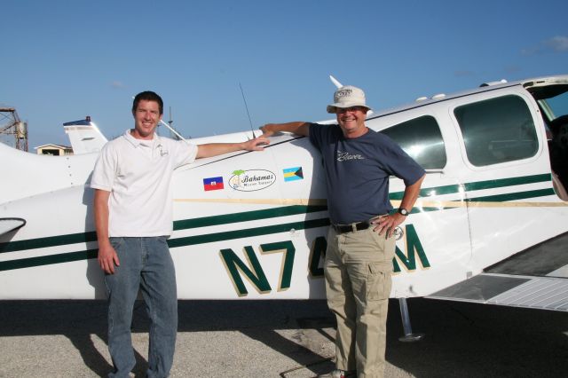 Beechcraft 55 Baron (N74EM) - Steve Merritt and Abraham McIntyre at Governors Harbor, Eleuthera.