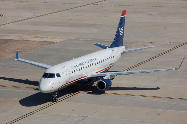 Embraer 175 (N124HQ) - US Airways ERJ-175 taxiing in for parking at A-18.