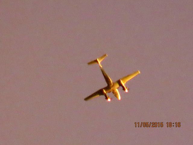 Beechcraft Super King Air 200 (N770SF) - Flying underneath the storm clouds with the sun shinning on the back side.