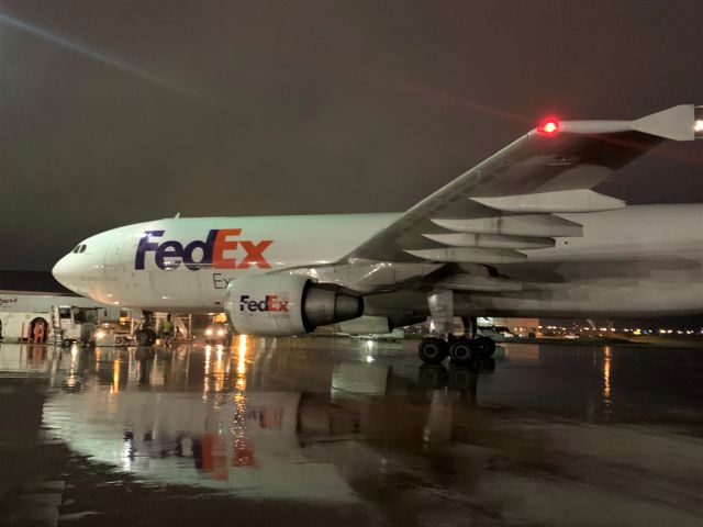 Airbus A300F4-600 (N742FD) - Tropical Depression Cristobal dumps a lot of rain on the FDX tarmac. br /br /Makes for a nice mirror image though.  