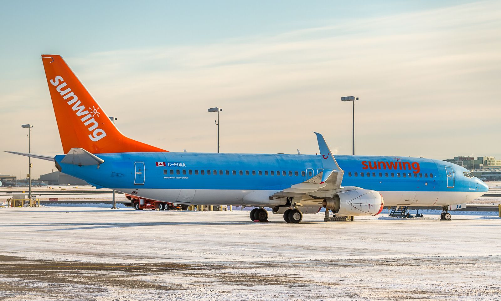 Boeing 737-800 (C-FUAA) - Some borrowed hardware from Europe sits on the FEDEX ramp on a frosty Boxing Day at YYZ