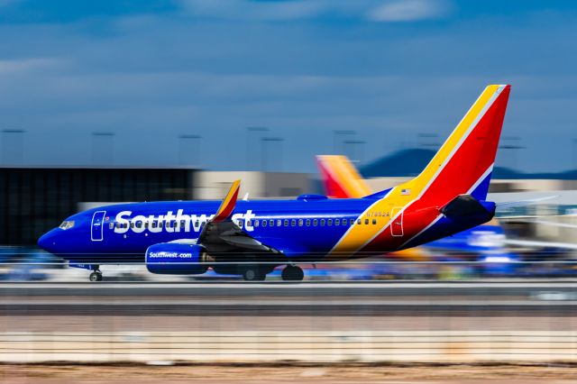 Boeing 737-700 (N7852A) - A Southwest Airlines 737-700 taking off from PHX on 2/23/23. Taken with a Canon R7 and Canon 100-400 EF ii lens.